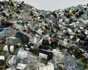 Mountain of recycled glass bottles