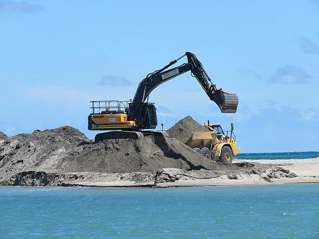 excavator extracting natural sand